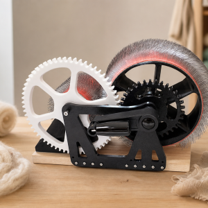 Wide homepage hero image of DrumCarder in a wool fiber craft studio